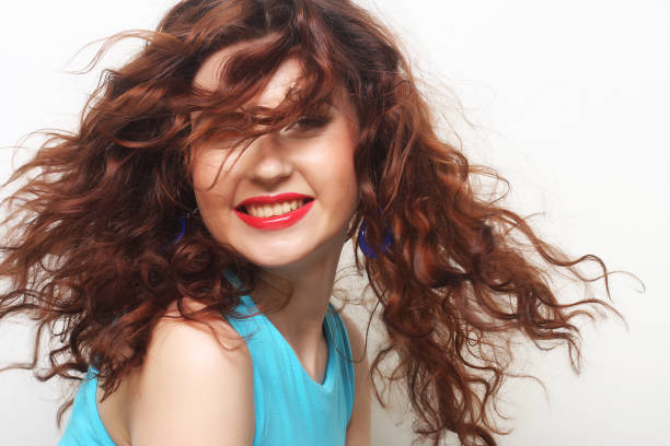 Young happy woman with curly hair
