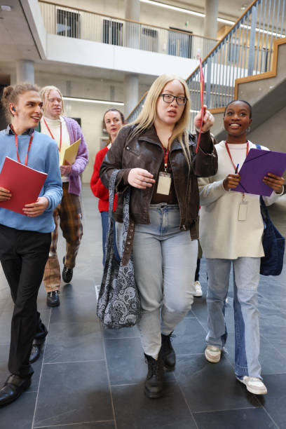 istock Disabled friends walking in community center 2196559605
