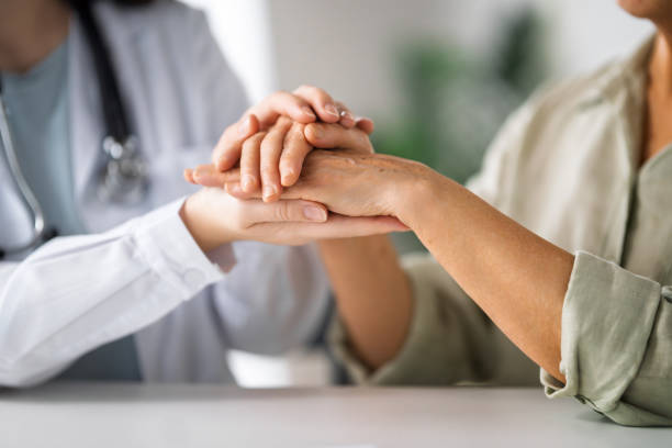 istock patient with a doctor in medical office 2196560559