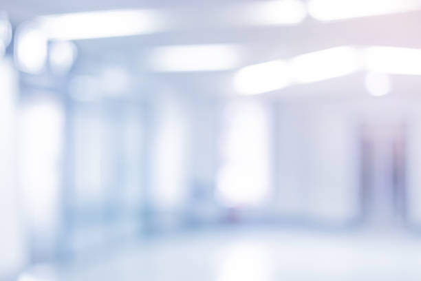 istock Abstract blurred inside interior of hospital building background with shine light for advertisement design and show content concept 2196561448