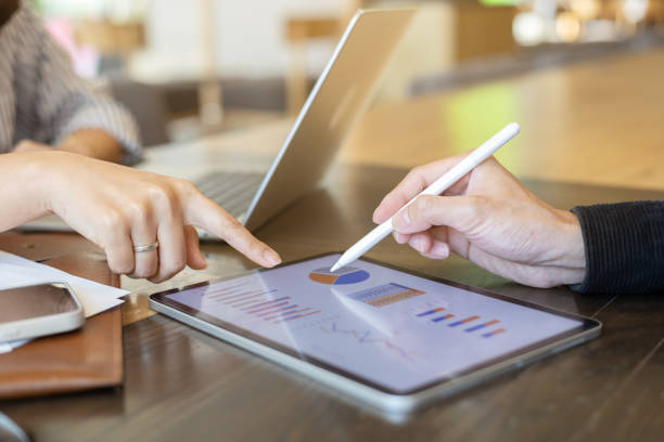 istock close up ceo or exceutive man hand use stylus to point on dashboard screen tablet device for check and share planning or consulting with businesswoman partner for business team and work from home concept 2196561452