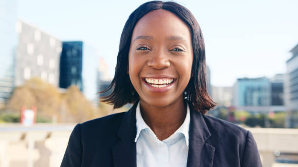 istock Smiling Professional Woman Outdoors in Urban Setting on a Sunny Day 2196562054