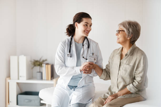 istock patient with a doctor in medical office 2196562599