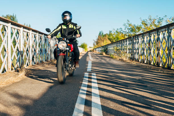 istock 40s man driving a Motorcycle On Road 2196564408