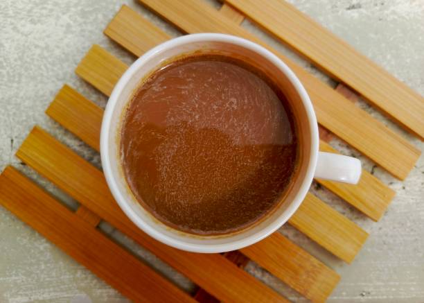 istock cup of coffee on bamboo mat top view 2196568631