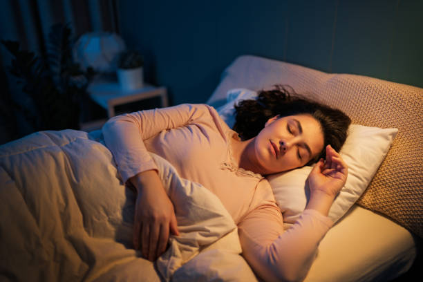 istock Woman is sleeping in her bedroom 2196569568