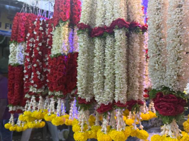 Floral gardens hanging in a display at the flower market Mysore