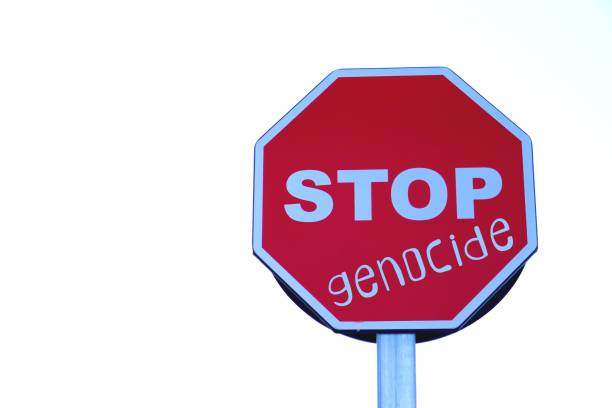 istock stop genocide concept. social problem. words written on highway stop sign. social problem. 2196573273