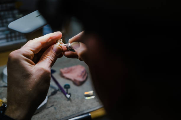 istock Close-up of hands crafting small object 2196574665