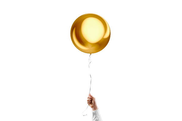 istock Hand holding blank gold sphere balloon mockup, isolated 2196575213