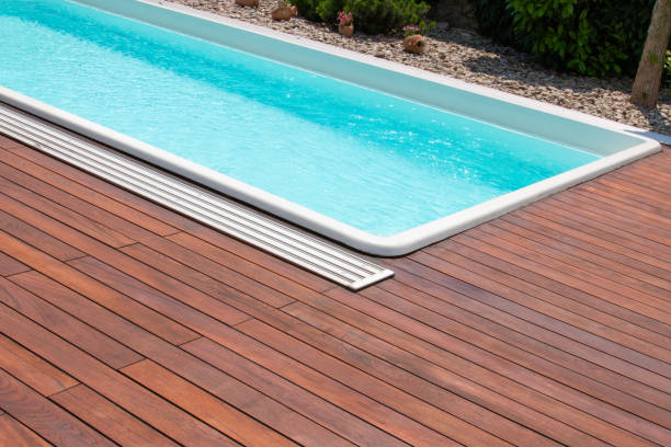 istock Teak wood deck next to the pool 2196576803