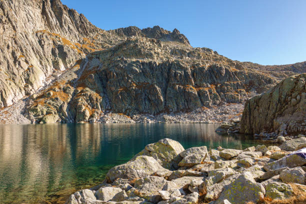 Beautiful autumn scenery in the mountains of the Belluno Dolomites with Lake ColdaiItaly