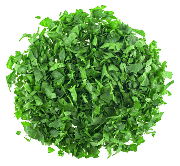 Sliced fresh parsley isolated on a white background, top view. Chopped parsley.