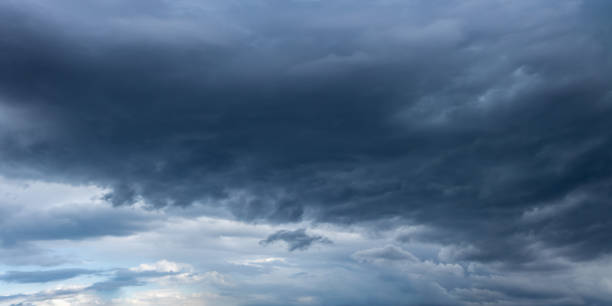 istock Dark storm clouds gathering in the sky, creating ominous atmosphere 2196578122
