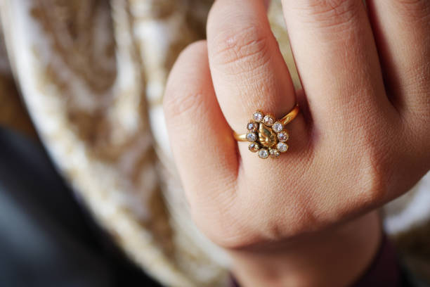istock This is an Elegant Gold Ring featuring exquisite Gemstone Accents set on a Delicate Hand 2196578579