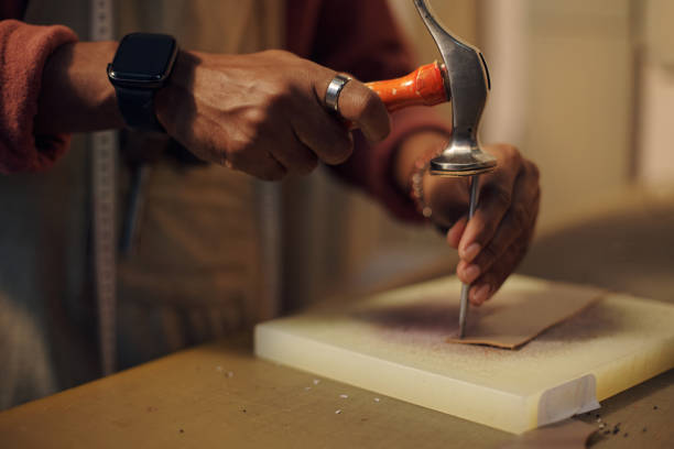 istock Close-Up View Showing Craftsperson Cutting Leather 2196579130