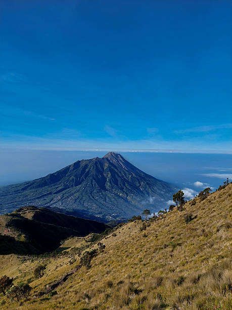 istock Epic lanscape view of Merapi Mountain with clear bluesky above it. 2196580447