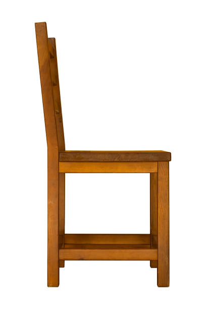 A simple wooden chair is isolated, side view.