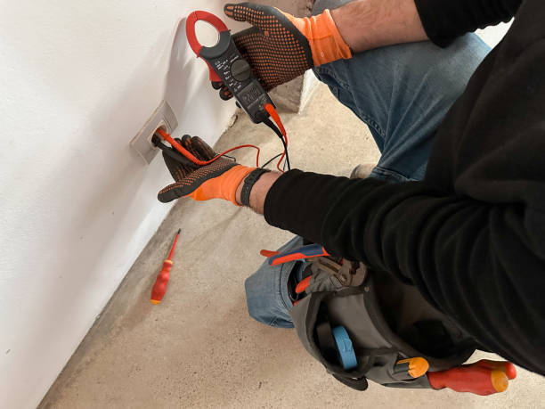 istock Electrician hands holding a multimeter clamp tester 2196581572