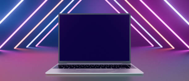 istock A laptop is displayed in a room with neon lights 2196582304