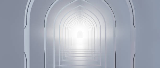 istock A long, narrow hallway with a light shining through the arched doorway 2196582382