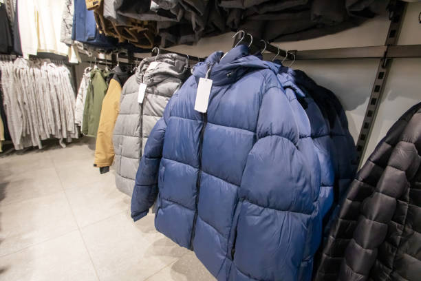 istock Warm winter jackets on hangers in the store 2196582467