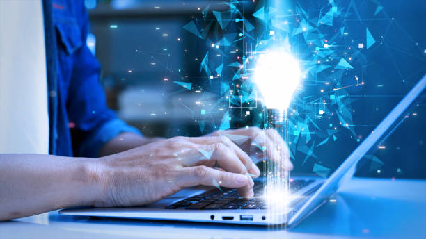 istock Hands typing on a laptop with a glowing lightbulb and futuristic digital elements, symbolizing innovation, creativity, and technology-driven ideas. 2196583894