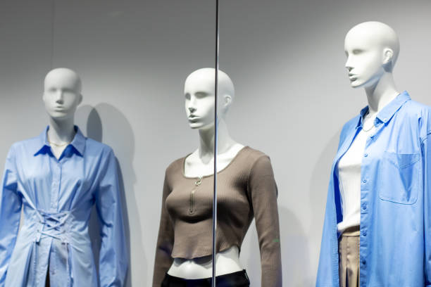 istock Three female mannequins on gray background closeup 2196584139