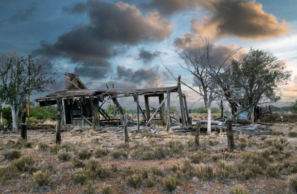 Abandoned wooden house in the Desert Arizona USA 1980. Sunset at the desert.