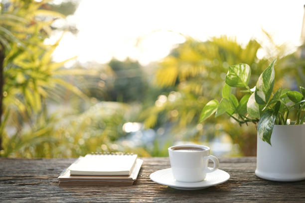 istock White coffee cup and notebook Cozy outdoor writing 2196587211