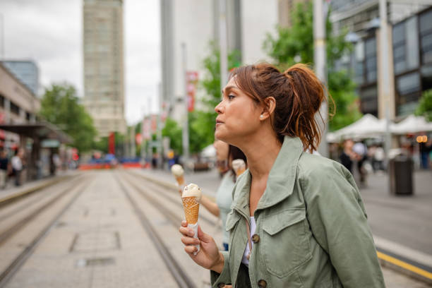 Enjoying a delightful ice cream treat while exploring the vibrant streets of Sydney, Australia with friends