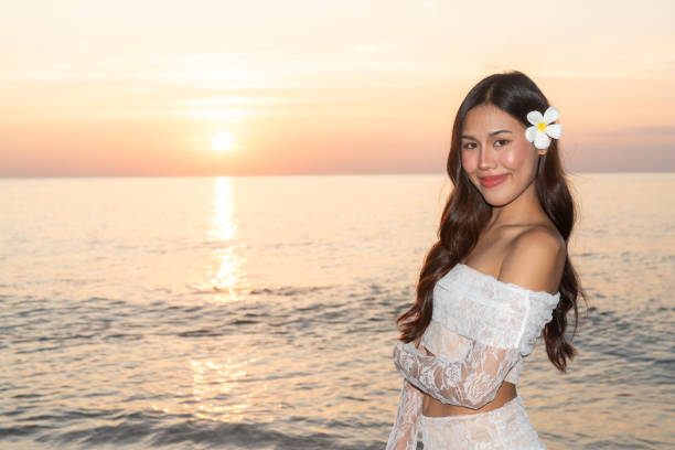 Beautiful Happy Young Thai Woman at Tropical Beach During Sunset