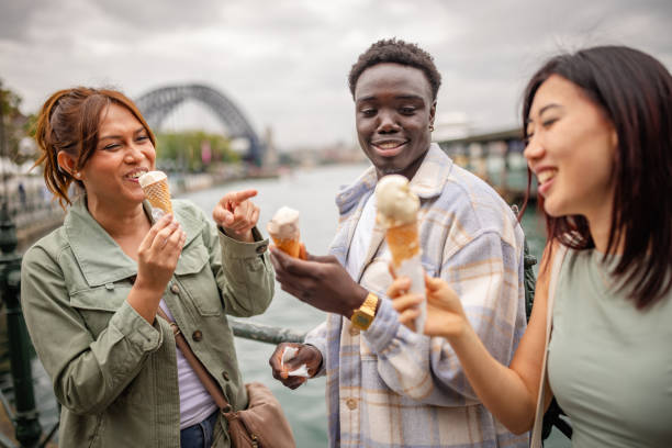istock Friends enjoy ice cream while exploring the vibrant riverfront of Sydney on a cheerful weekend 2196593923