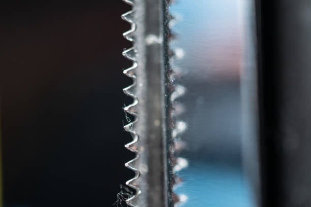 Sharp metal teeth of a knife.