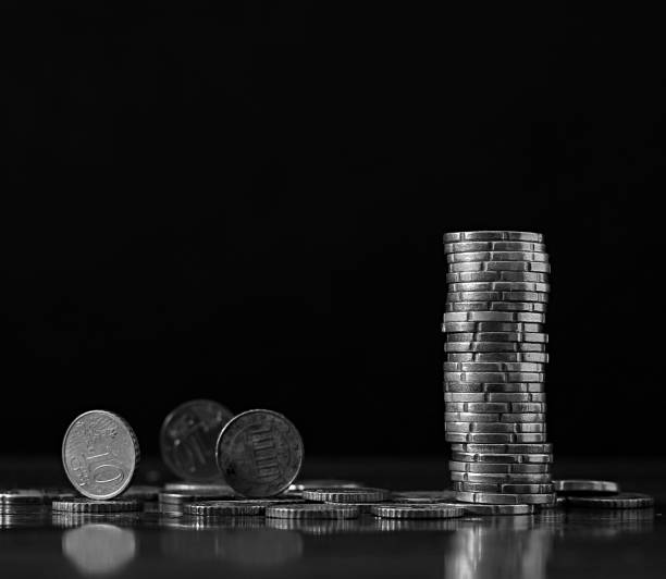 istock saving coins with money to pay bills 2196596722