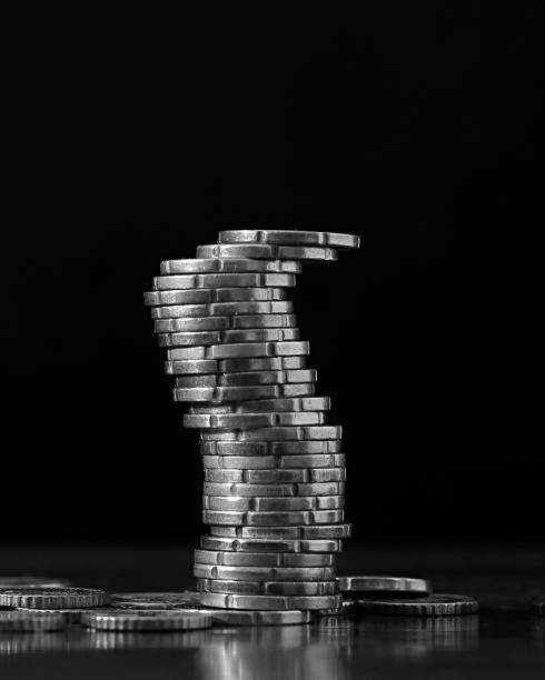 istock saving coins with money to pay bills 2196598897