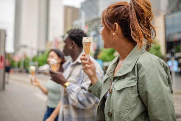 istock Joyful friends savoring ice cream while exploring Sydney's vibrant urban landscape 2196599206