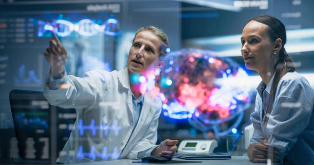 istock Medical Professional Talks with Patient Using Futuristic Holographic Brain Model. Mapped Neural, Genomic Data, Holographic Interfaces, Neuroplasticity and DNA Markers, Precision Neuromodulation 2196602817