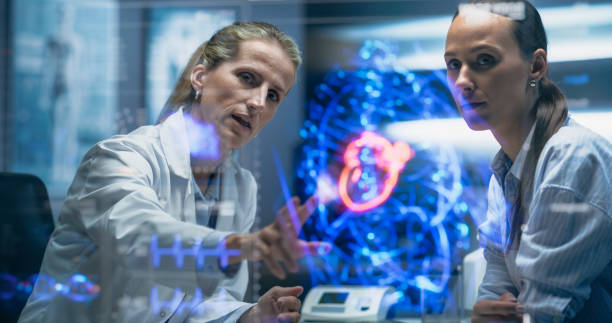 istock Physician and Patient Analyze a Holographic Body Model. Technology Discussions on Optimizied Health Care, Diagnostic Accuracy. Personalized Treatment Approaches In A Futuristic Healthcare Environment 2196602895