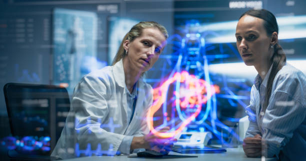 istock Physician and Patient Analyze a Holographic Body Model. Technology Discussions on Optimizied Health Care, Diagnostic Accuracy. Personalized Treatment Approaches In A Futuristic Healthcare Environment 2196602959