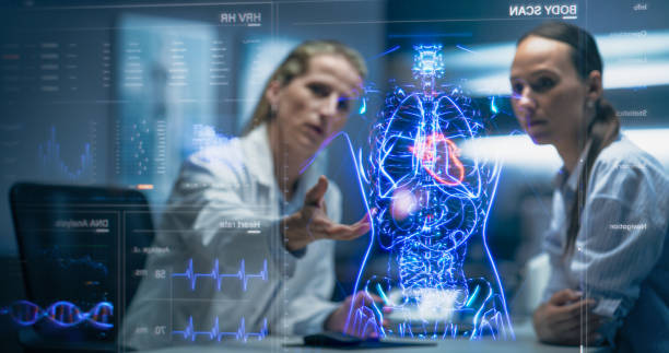 istock Physician And Patient Examine Holographic Body Models. Biosensors And AI-Driven Tissue Mapping Integrate Real-Time Metabolic Markers, Nanoscale Diagnostics, Targeted Biomolecular Intervention Planning 2196602997