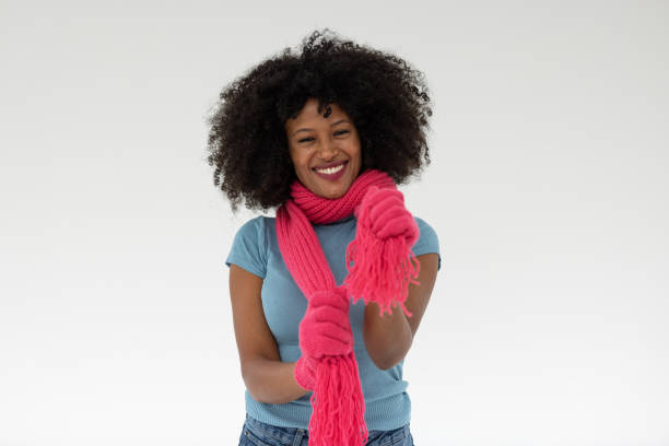 Green knitted scarf on a white background.