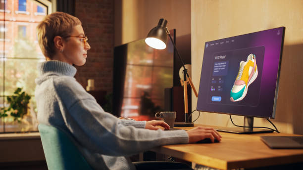 istock Creative Young Woman working on Her Clothing Brand Uses an AI Image Generation Interface on a Computer. Screen Displays AI generated Image of Sneaker. Creative Digital Artist and Ai Chatbot Design 2196603814