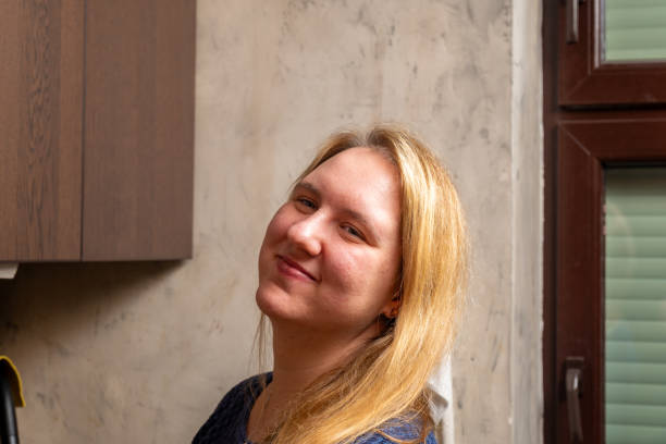 istock Smiling woman in a kitchen, preparing meals and enjoying the atmosphere 2196603819