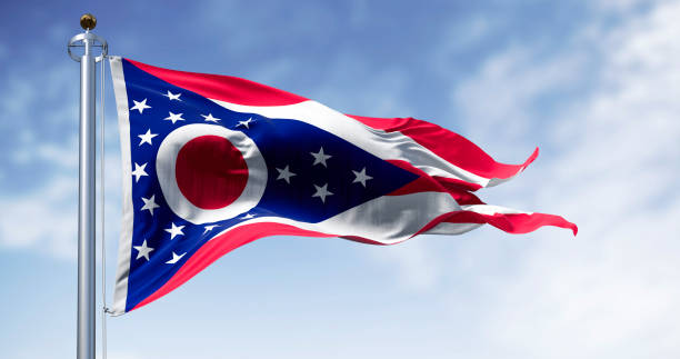 istock The Ohio state flag waving in the wind on a clear day 2196607915
