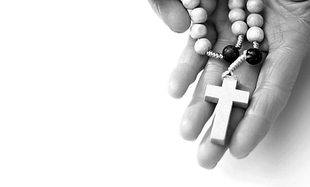 istock praying to god with hands together 2196607927