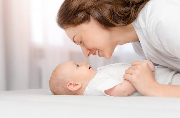 istock mother and her baby looking at each other 2196610148