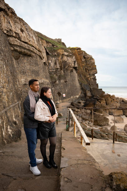 istock Couple on a rocky coast in Sintra 2196611446