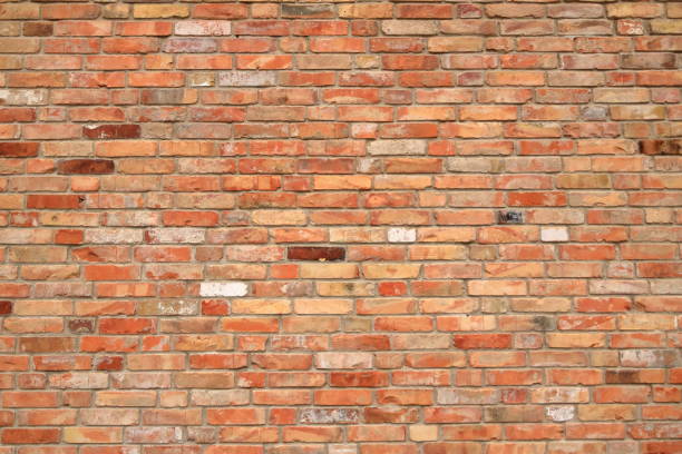istock Old brick wall, old texture of red orange stone blocks 2196613332