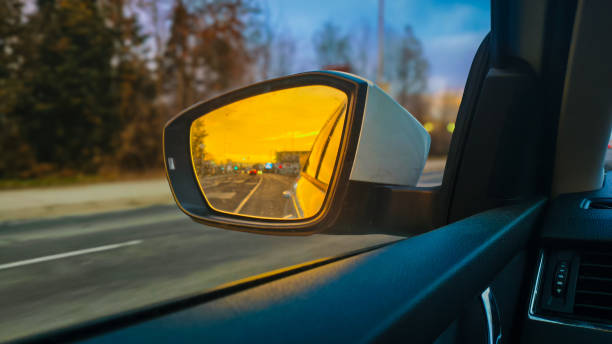 istock view through the rearview mirror at sunset 2196616611